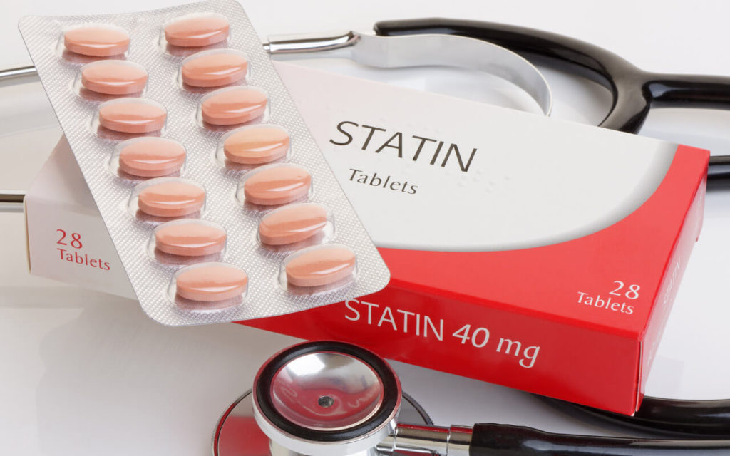 statin tablets on top of a stethoscope